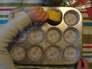 kid making cupcakes