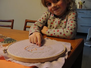 kid with embroidery hoop