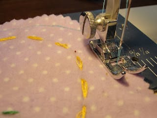 sewing machine stitching around easter egg pillow