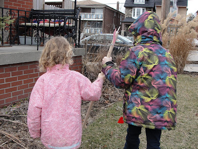 kids putting wind vane in the ground
