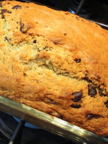 close up of chocolate chip banana bread in pan