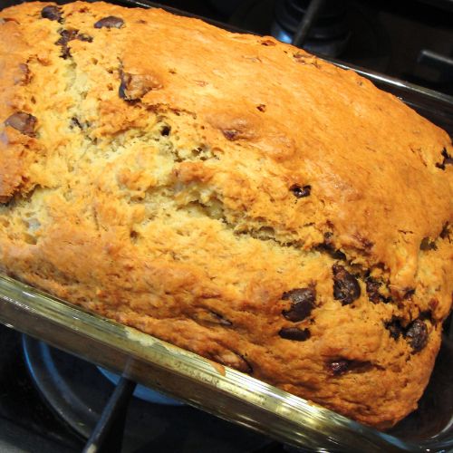 close up of chocolate chip banana bread in pan
