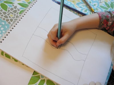child sketching artwork