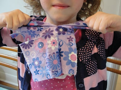 kid ripping fabric scraps