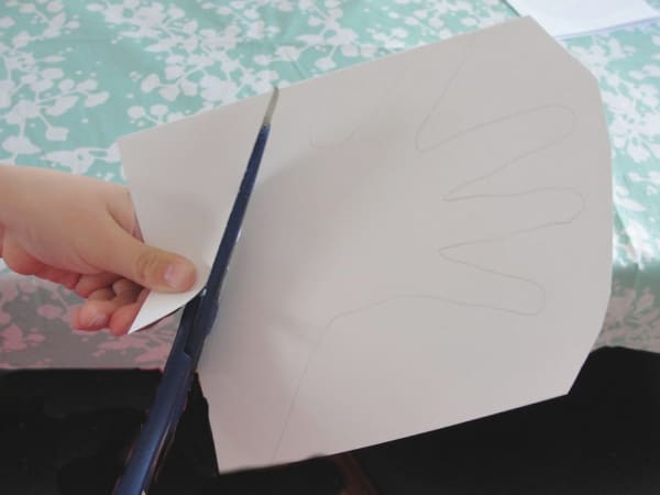 scissors cutting out handprint