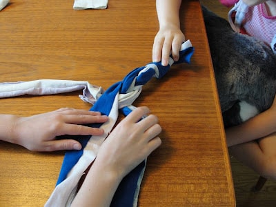 child braiding t-shirt strips