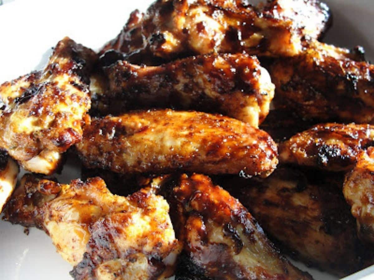 barbecue chicken wings with spice rub and bbq sauce done being grilled