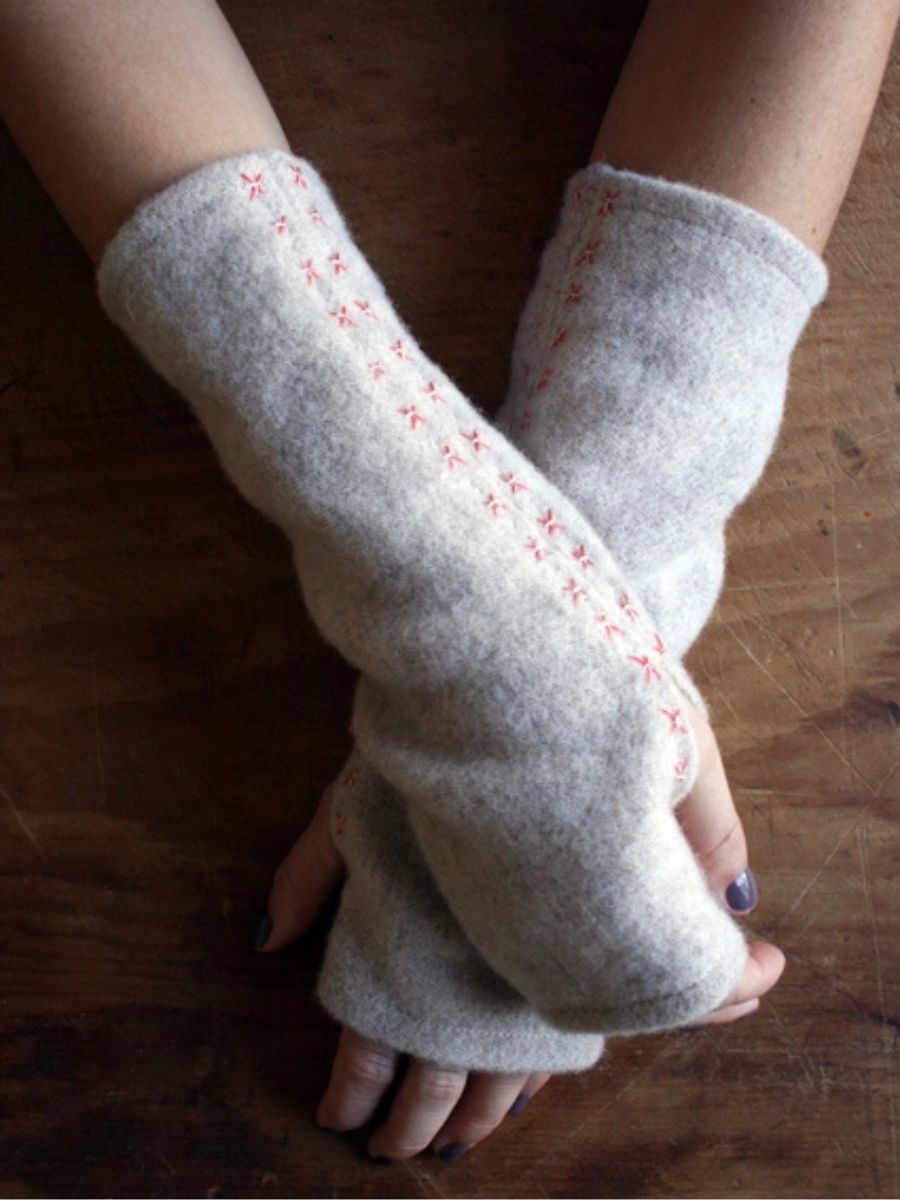 woman with handmade wrist warmers on