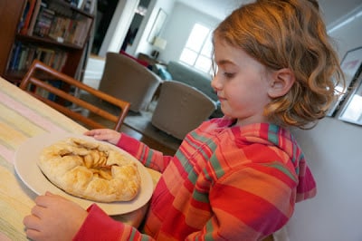 child with apple galette