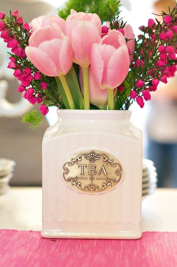 flower arrangement in a tea canister