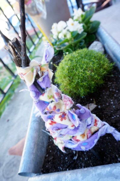 fairy house made of sticks in the fairy garden