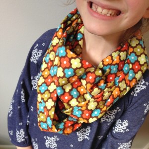 happy child wearing infinity scarf