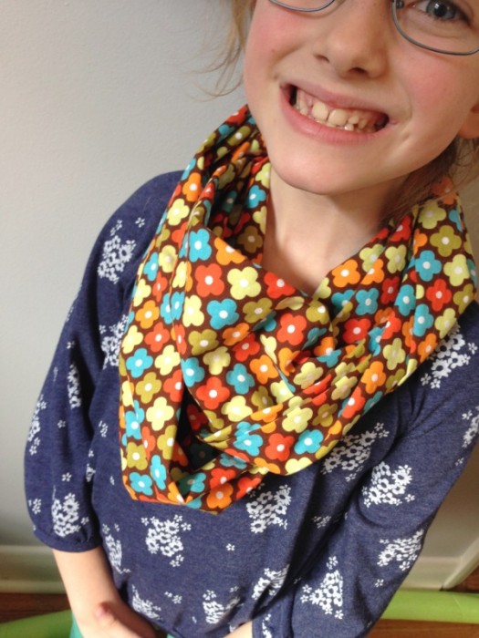 happy child wearing infinity scarf