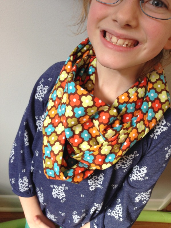 happy child wearing infinity scarf 