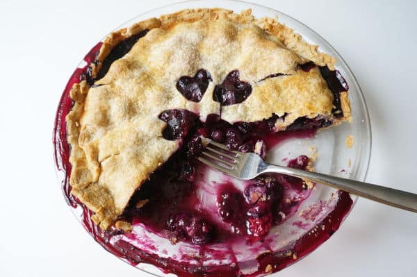 blueberry pie baked with fork