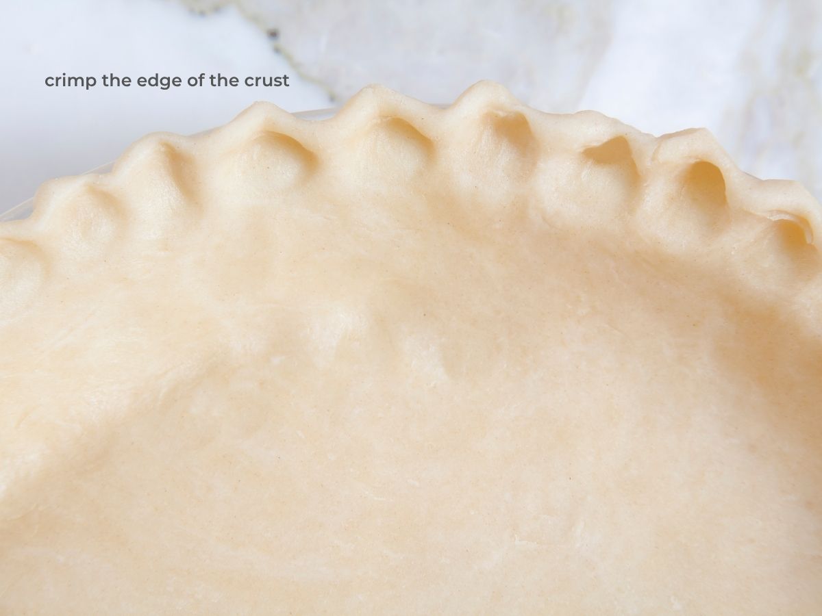 close up of edge of pie crust crimped