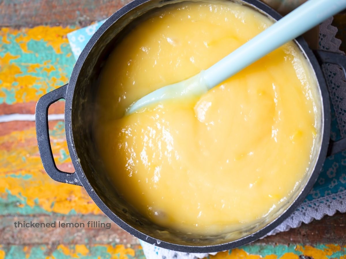 close up of pot filled with lemon curd filling for lemon meringue pie