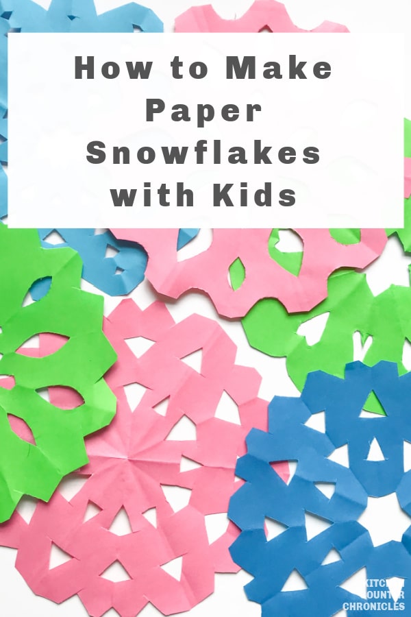 How to make paper snowflakes with kids a pile of colourful paper snowflakes