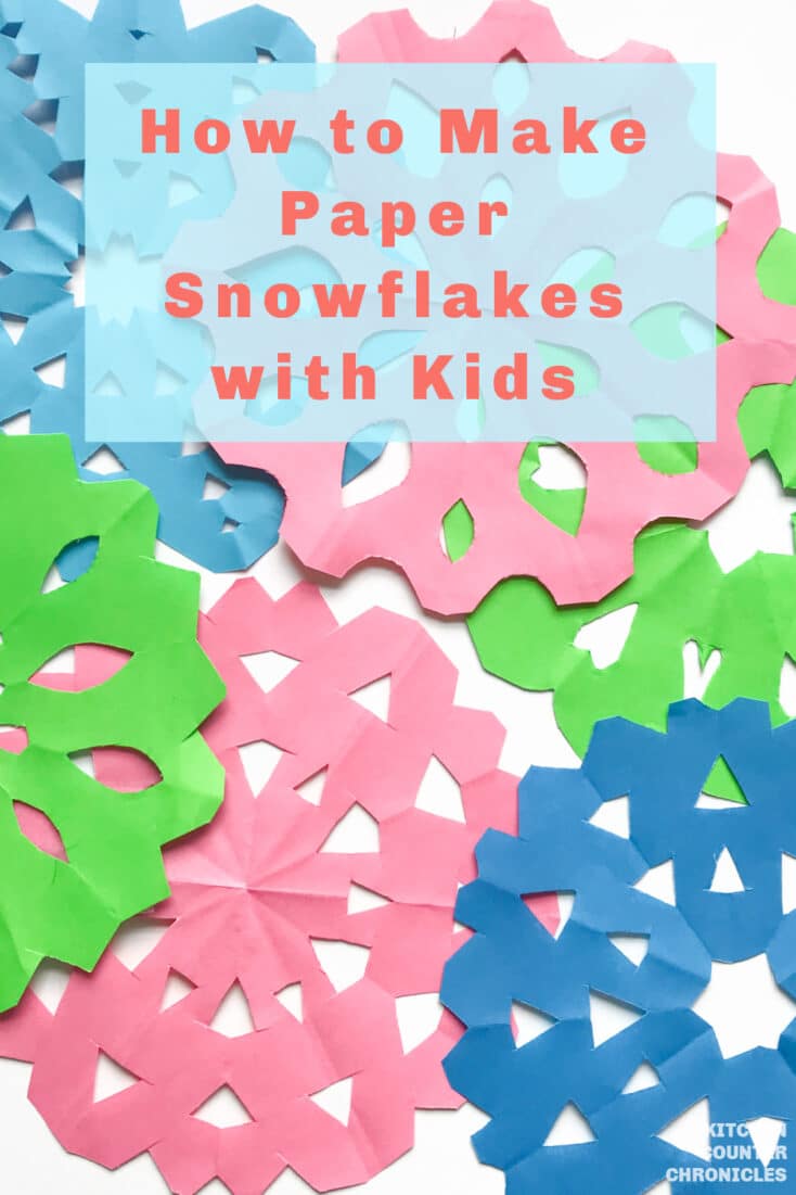 title how to make paper snowflakes with kids and pile of paper snowflakes