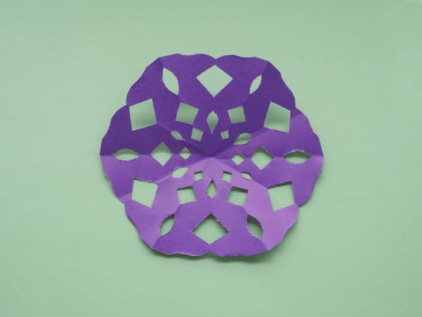 final purple paper snowflake unfolded