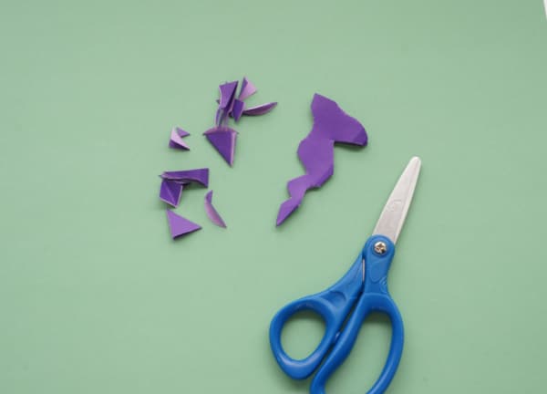 paper snowflakes cut out design with scissors