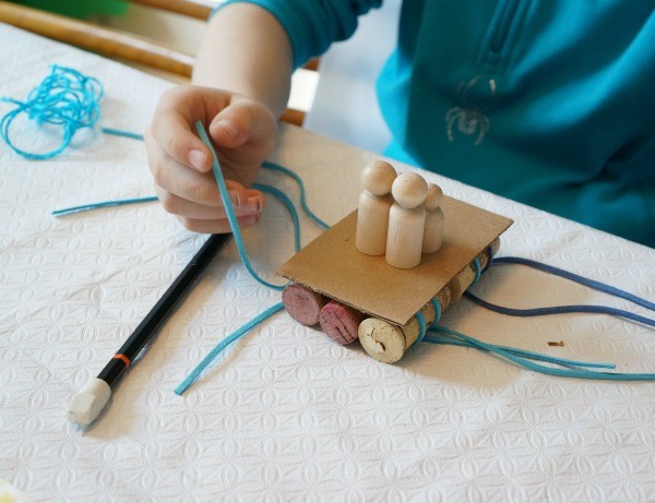 cork raft almost done with peg people on kids raft