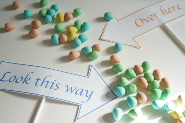 outdoor easter egg hunt printable signs with chocolate eggs