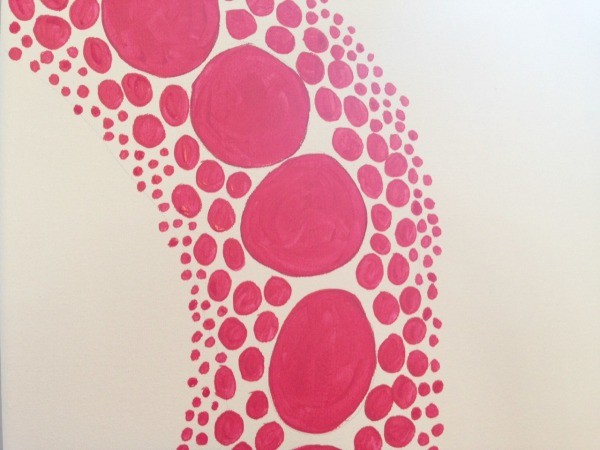 close up of series of red polka dots painted on canvas by child inspired by yayoi kusama artwork