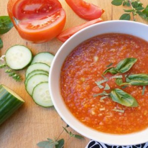 gazpacho in bowl with basil on top