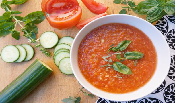 gazpacho in bowl with basil on top