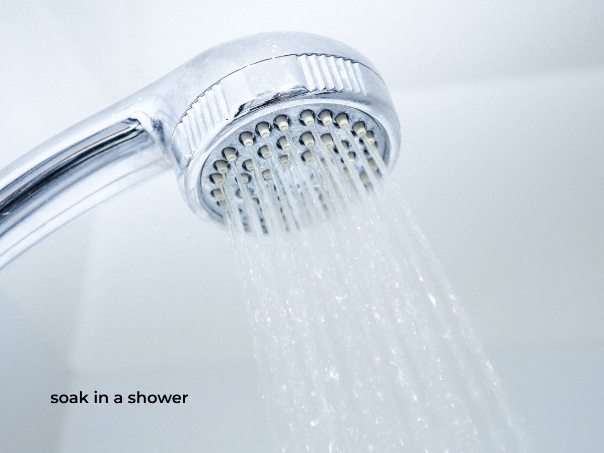 text soak in a shower with image of shower head for migraine relief
