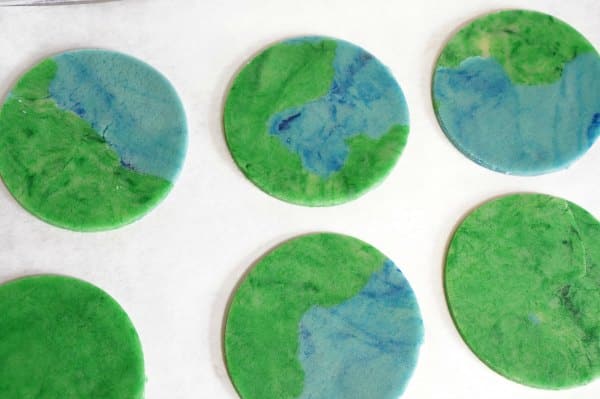 Earth Day cookie cut out on baking sheet