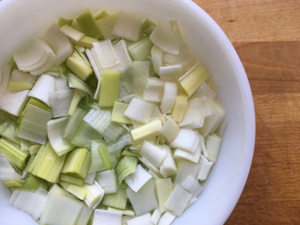 leeks being cleaned in bowl
