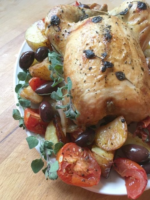 greek roasted chicken on platter