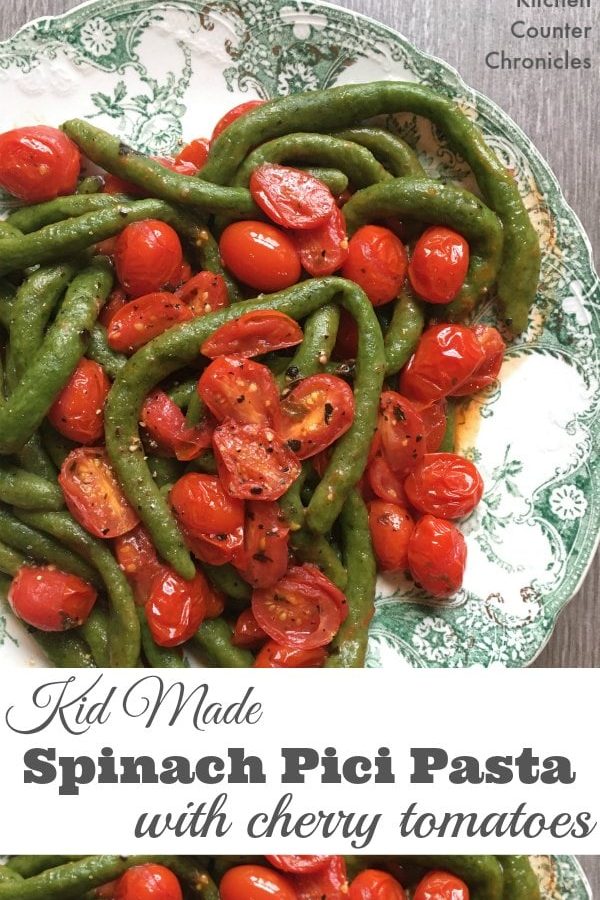 Kid Made Spinach Pici Pasta with Cherry Tomato Sauce - Get the kids in the kitchen making pasta from scratch. This pasta is packed with healthy spinach...the kids are going to love making this and eating it too. | Kids in the kitchen | Family Pasta Recipe | Homemade Pasta Recipe | Cooking with Kids | Vegetarian Recipe for Kids |