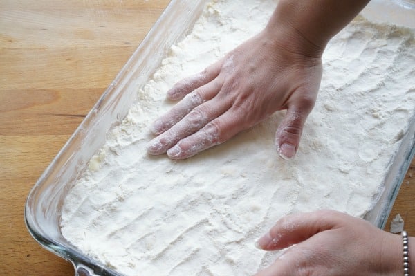 lemon bars pressing crust into baking pan