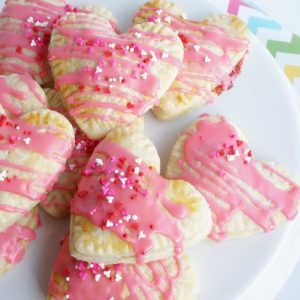 homemade strawberry pop tarts heart shaped on white plate
