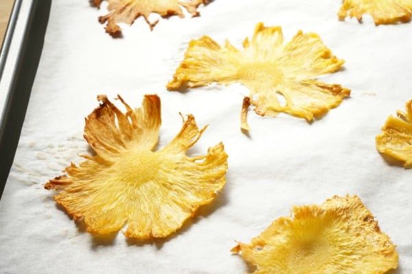 dried pineapple flowers on baking sheet