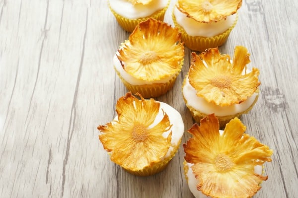dried pineapple flowers on cupcakes