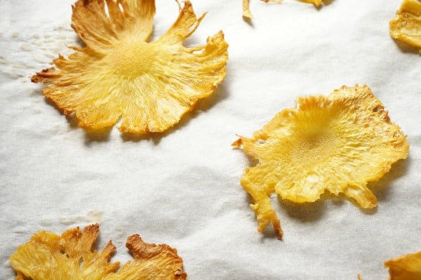 dried pineapple slices on baking sheet