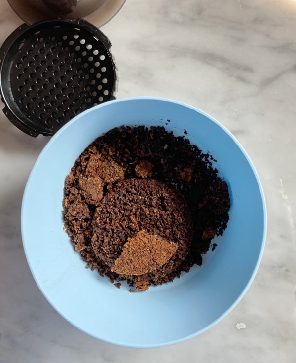 coffee grounds in a small bowl for the garden