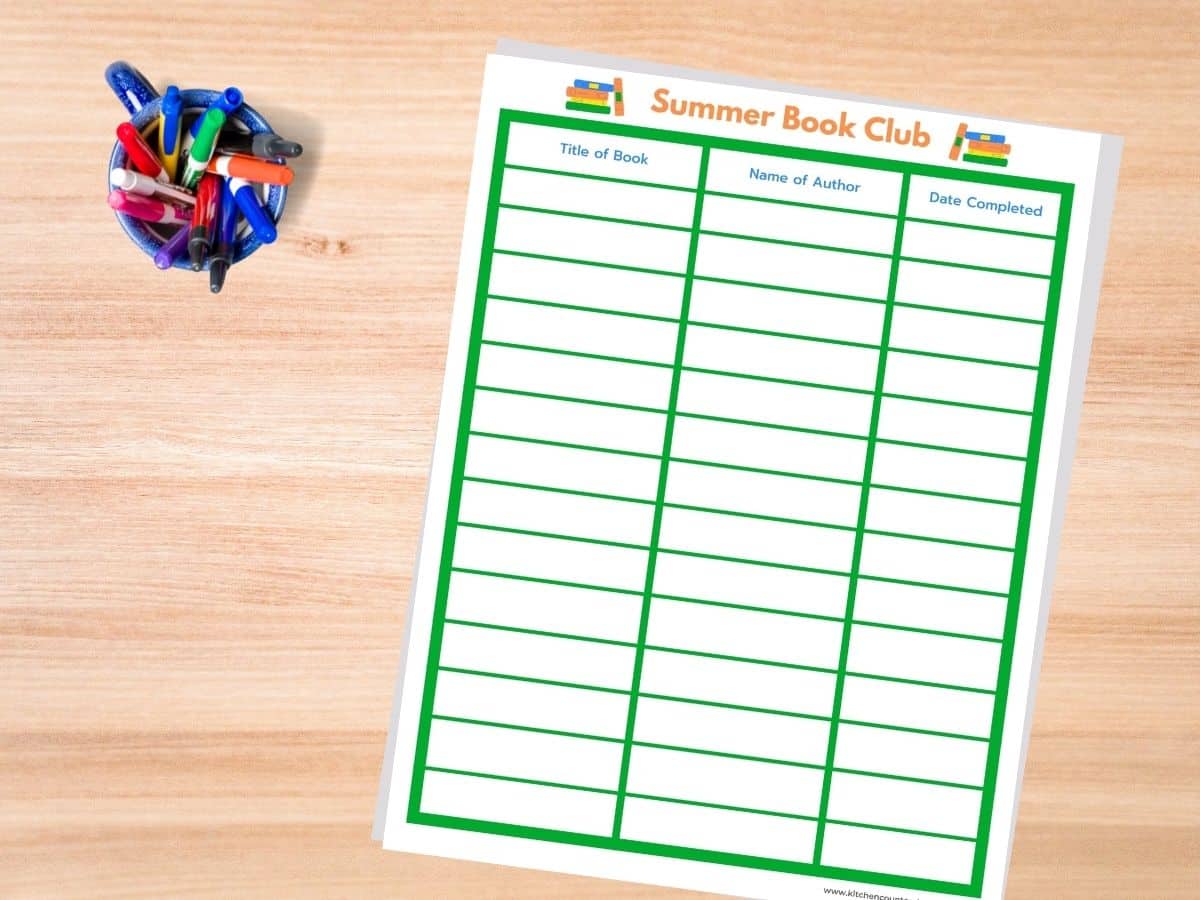 summer book reading log printed out with cup of pens and markers