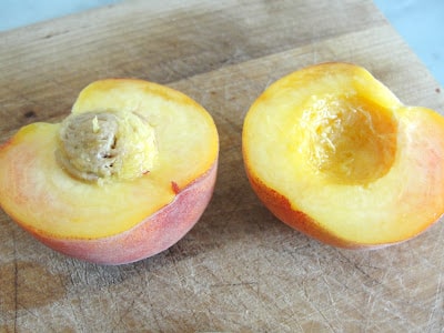 sliced peach with pit