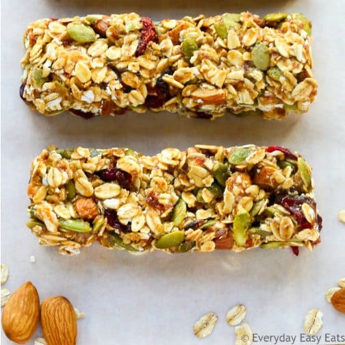 granola bars filled with nuts and seeds and dried fruit on plate