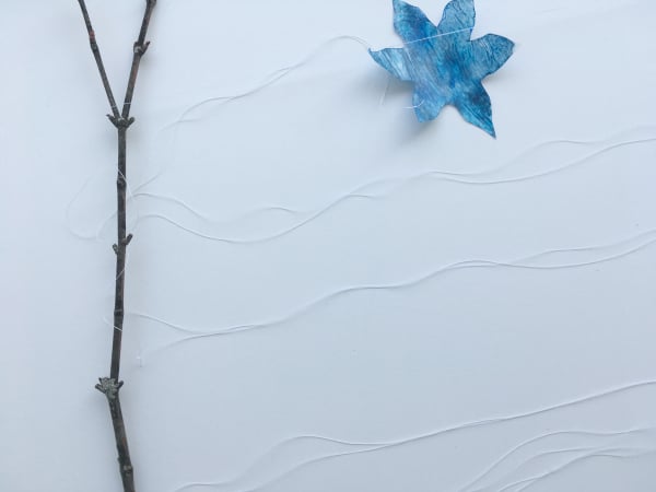 snowflakes looped over branch