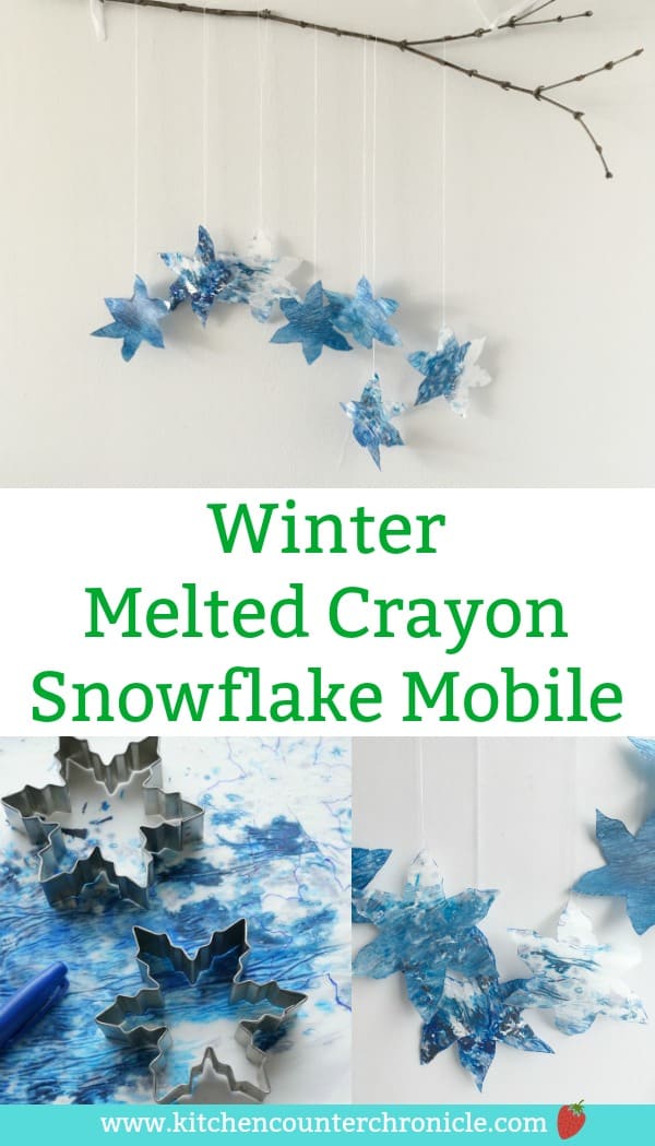 winter melted crayon snowflake mobile - A lovely winter craft for kids to make. Gather up your old crayons and snowflake cookie cutters to make a beautiful snowflake mobile. #wintercraft #snowflake #snowcraft #mobilecraft #craftforkids
