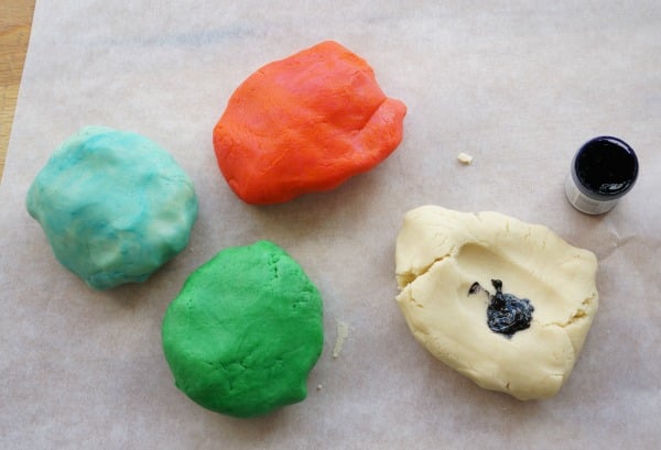 rainbow cookie dough being coloured