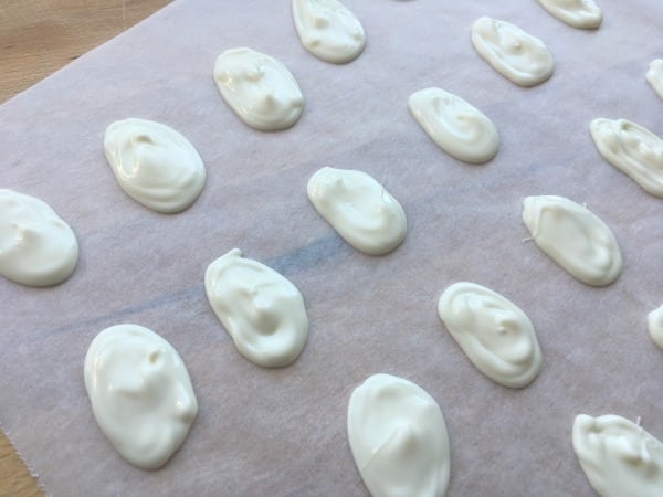 white chocolate eggs on sheet