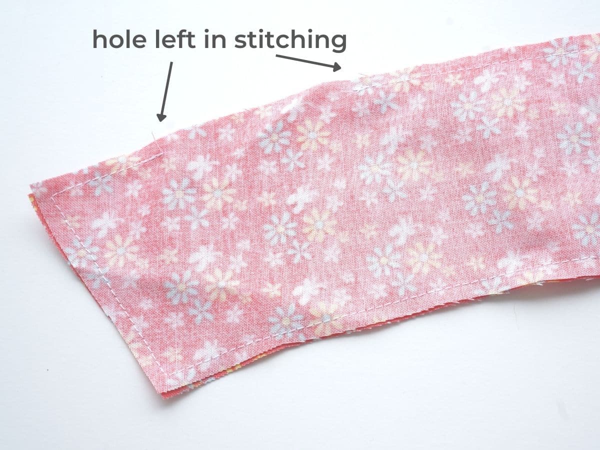 wrong sides of fabric pieces sewn together except a hole left in stitching to turn the piece right way around