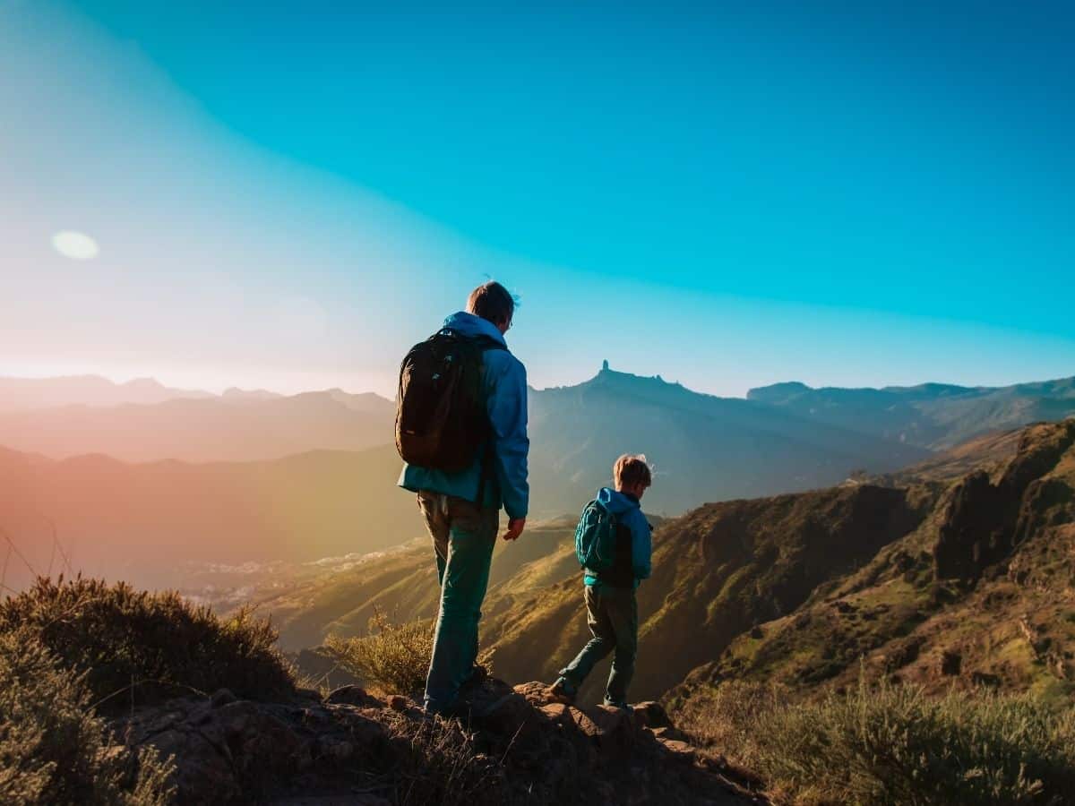 fathers day hike with kid and dad on mountain trail